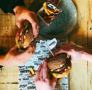 DARING Foods plant-based burger, melted vegan cheddar & mozzarella, crispy onions, dill pickle, salad & not so secret burger sauce at Down to Earth in Glasgow