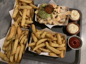 Fries, the one at right bottom is with guacamole (vegetarian because of parmesan cheese on top) at Friet Elite in Maastricht