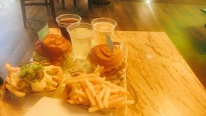 chicken burgers & (loaded) fries at Vedang - green burger | Mall of Berlin in Berlin