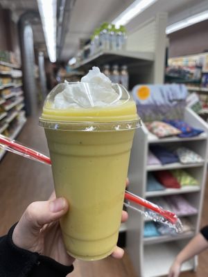 Mango Tango smoothie with coconut whipped cream $8  at Total Health Foods in Wyandotte