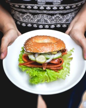 Ahimsa Smoked "Salmon" Bagel 
toasted poppy seeds bagel, vegan cream cheese, plant-based smoked "salmon", lettuce, cucumber, pickled radish, sweet red onion at Dharma Coffee Canggu in Canggu