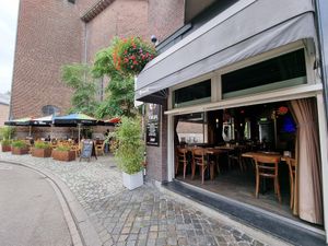 Large outdoor seating area at Café Forum in Maastricht