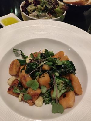 Sweet potato gnocchi. Green leaf salad (if you love vinegar go for it). at Glass Brasserie in Sydney