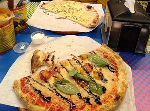 Moscow pizza (front) and Nairobi pizza (back). Homemade crisps with dip on the left. at POW - The Vegan Pizzeria in Copenhagen