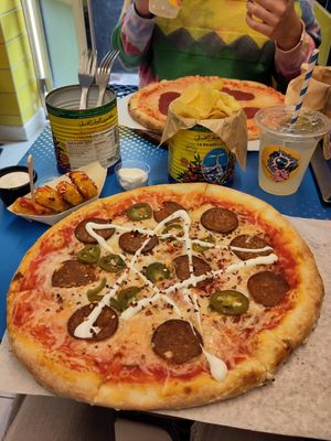 Spicy pepperoni pizza meal and nuggets at POW - The Vegan Pizzeria in Copenhagen