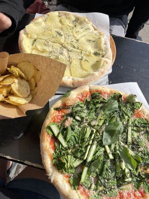Helsinki Pizza (green), Nairobi Pizza (potatoes), and house made potato chips   at POW - The Vegan Pizzeria in Copenhagen
