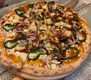 The Mexicana, but we also added pineapple and mushrooms. Amazing pizza!! Definitely recommend   at Jonny Como Pizza in Playa Del Carmen