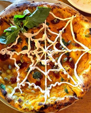 Weekly fall special pizza: pumpkin purée, cashew web cheese, pesto, cranberry purée dollop.  at Double Zero in Venice