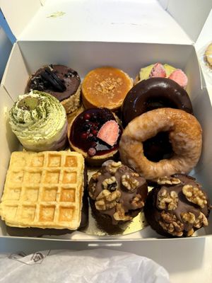 Selection of cheesecakes, waffles, doughnuts and brownies (all vegan and gluten-free) at Healthy Cakes in Valencia