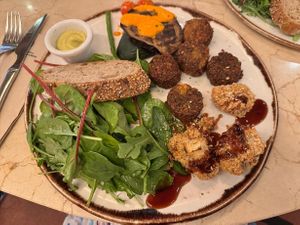Falafel, coliflower florets, grilled veggies with green curry sauce at Margarito in Bilbao