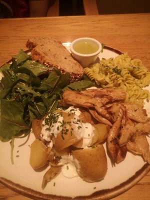 Heura, fusili with pesto, green coconut sauce, bread, salad and potatoes at Margarito in Bilbao