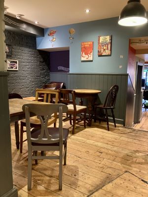 Interior with book covers on the wall  at Coffee #1 in Brecon
