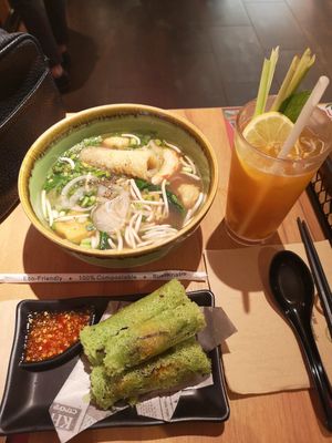 Vegan pho, vegan 'imperial rolls', passion fruit and lemon iced tea at NamNam - Raffles City in Central Singapore