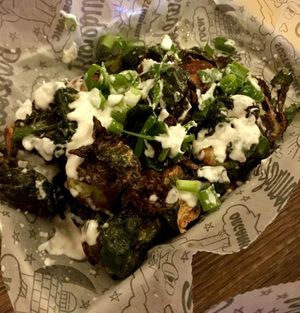 Crispy Brussel sprouts, Uptown Style. Vegan parmesan, garlic aioli, scallions. at Bareburger - Ditmars in Astoria