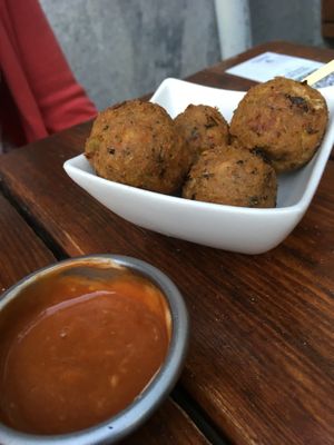 Chickpea cheese balls appetizer at Vegan Junkies in Lisbon