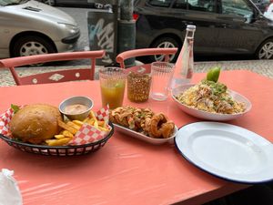 Burger w/fries, Onion rings and loaded nachos. at Vegan Junkies in Lisbon
