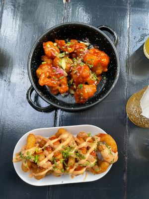 Appetizers cauliflower hot wings and onion rings at Vegan Junkies in Lisbon