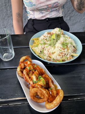 loaded nachos and onion rings  at Vegan Junkies in Lisbon