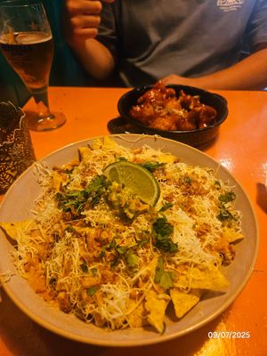 Nachos and cauliflower wings at the back at Vegan Junkies in Lisbon