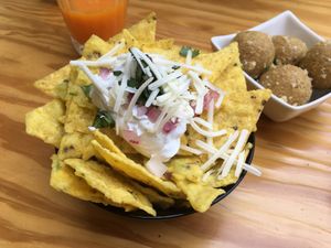 Chilaquiles (Totopos sauteed in salsa verde served with smoked cheese, onions, sour cream and coriander) at Vegan Junkies in Lisbon
