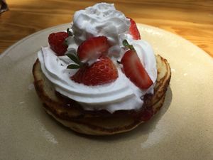 Panquecas da Jô (pancakes with  raspberry jam, whipped cream and strawberries) at Vegan Junkies in Lisbon