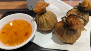 EDAMAME & COCONUT MONEYBAGS with sweet chilli sauce - $14.5 at Yulli's in Surry Hills