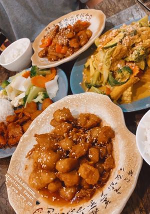Clockwise from top- honey chicken, laksa, sweet n sour pork, and char siu  at West End Vegan Restaurant in West End
