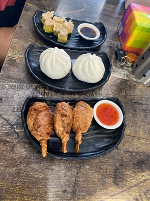 Steamed dim sim, bbq pork bun, and chicken drumsticks  at West End Vegan Restaurant in West End