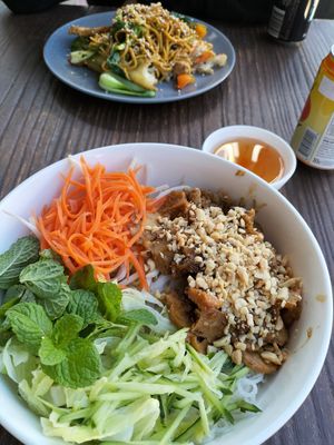 Lemongrass chicken vermicelli salad (foreground) and black bean hokkien noodles (background) at West End Vegan Restaurant in West End