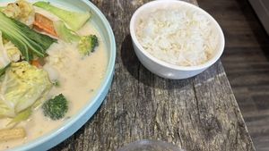 Rice served separately with the yellow curry.  at West End Vegan Restaurant in West End