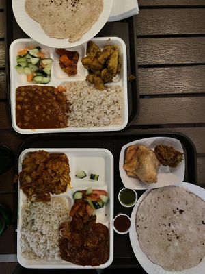 Top plate includes taro curry and Chana masala. Bottom plate includes aloo gobi and the soy chicken curry. Both include brown rice, spicy pickle, and salad    at India Sweets and Spices in Culver City