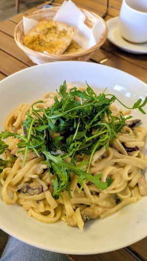 Yum. Freshly made, delicious creamy pasta, with rosemary garlic bread on the side. at Allison's Eatery in Bury St Edmunds