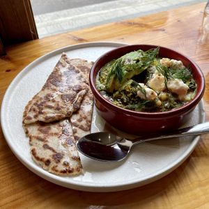 Green Shakshuka. A yummy, warm, bean- based savoury bowl, served with flat bread. Glad it wasn’t spicy at all. The Soyoyoy tofeta was a nice touch.   at Little Lotus Cafe in Hobart