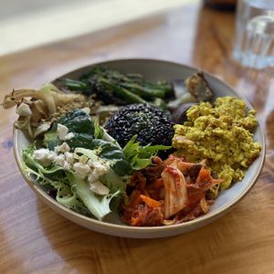 Nourishing Plate. Roasted seasonal veggies (asparagus), cabbage, black rice, tofu scramble, kimchi, and salad greens with tofeta.   at Little Lotus Cafe in Hobart
