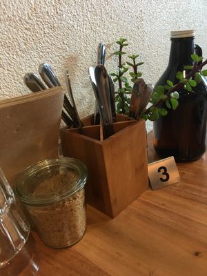 Beautifully crafted wooden tables, filtered table water, coconut sugar  at Little Lotus Cafe in Hobart