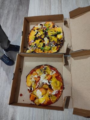 Two small pizzas, the top one matches the size indicated in store at Pizza This Pizza That in Nambucca Heads