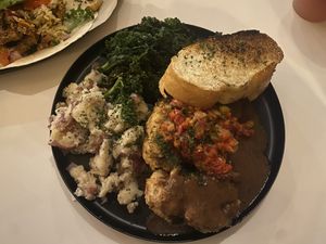 Country Fried Caulisteak With Toast, Potatoes & Kale  at Vegan Food House in Dallas