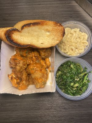 Citrus mango cauliflower wings, bread, macaroni, and greens   at Vegan Food House in Dallas