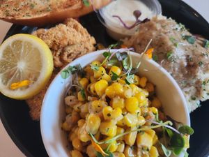 Fried "fish" oysters, corn, mashed potatoes, and garlic bread at Vegan Food House in Dallas