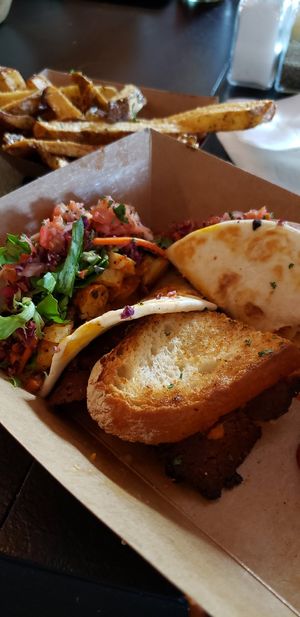 Sharing BLT and Blackened Shrimp street tacos at Vegan Food House in Dallas