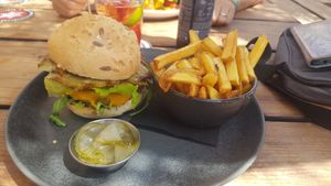 Artichoke burger with vegan cheese and fries at The Olive Tree in Mallorca