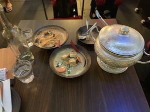 Red and green curry with a pot of rice at Thai Rock in Prairiewood