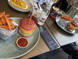 Vegan quinoa burgers, planted chicken/hummus bowl, ramen soup/bowl and local ice tea at No Name in Chur