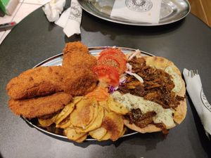 Vegan variety, schnitzel, fries, salad, gyros at Roots Foods and Culture in Athens