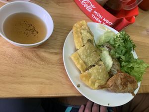 Lemongrass thigh, pillow cake, and spring roll (already ate some of the spring roll though) at Pho Chay in Hanoi