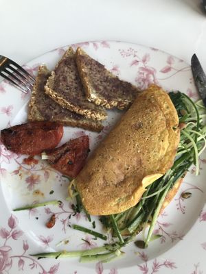 Vegan green kale and avocado chickpea omelette with olive repented toast. Looked so yummy I took a bite before I remembered to take picture! 🤣 at Leen's in Dubai