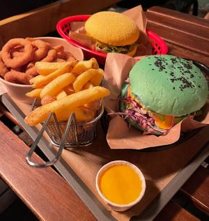 She Hulk Burger, Bacon BBQ Burger, onion rings and fries at EnVie Vegan in Geneva