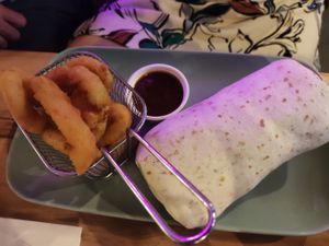 Burrito and onion rings at EnVie Vegan in Geneva