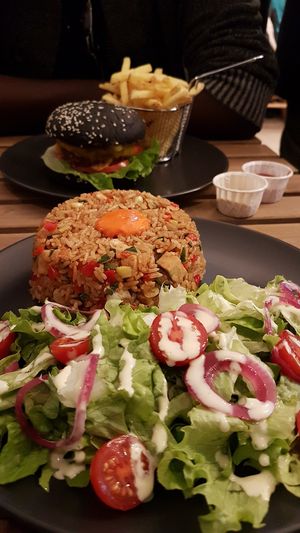 Riz sauté et dark knight burger at EnVie Vegan in Geneva