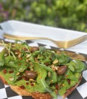 Microgreens avocado toast with almonds, red pepper flakes and olives. So good   at SunRise Cafe in Hilton Head Island